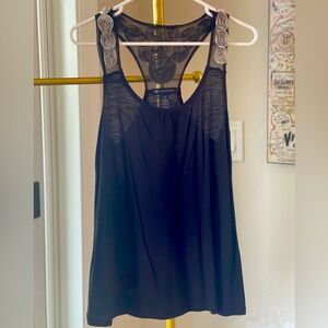 Black tank top with floral detail on straps